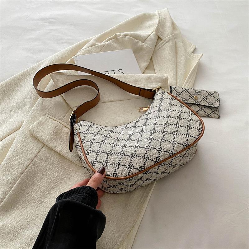 

2025 новая женская сумка ретро премиум универсальная ins текстура сумка подмышку популярная в этом году корейская версия сумка через плечо женская светло-серый