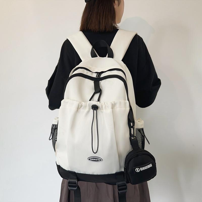 Casual backpack backpack new large-capacity Japanese and Korean boys college students solid color schoolbag