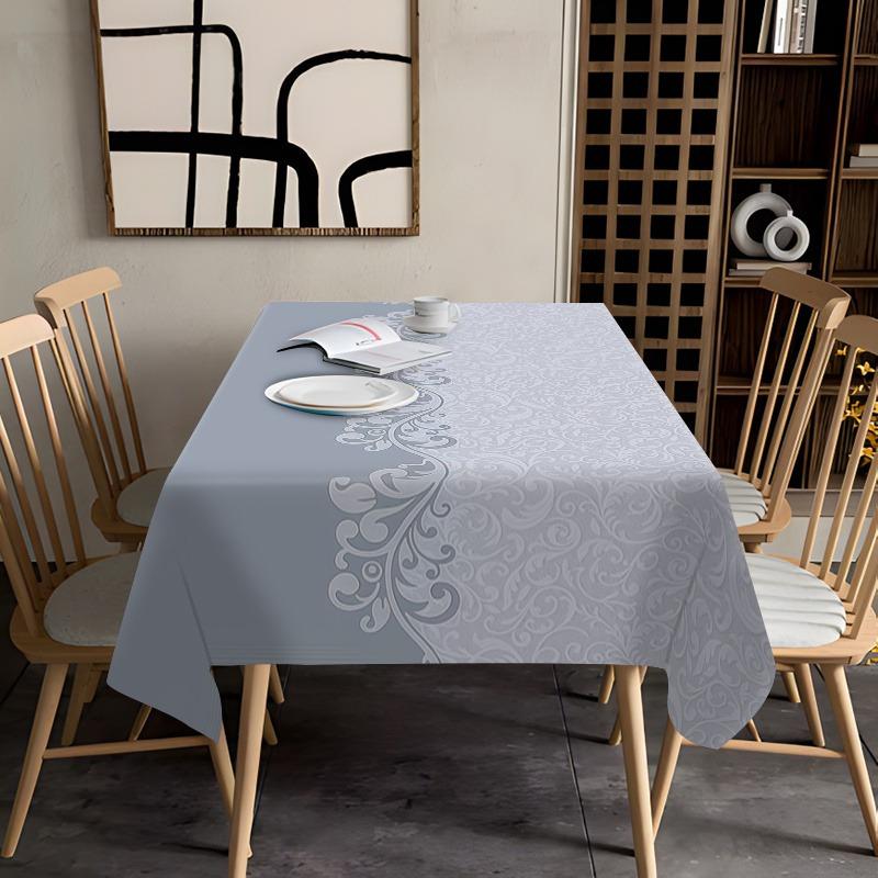 One modern-style tablecloth in light blue, gray and white patterns, made of rectangular durable polyester fabric.