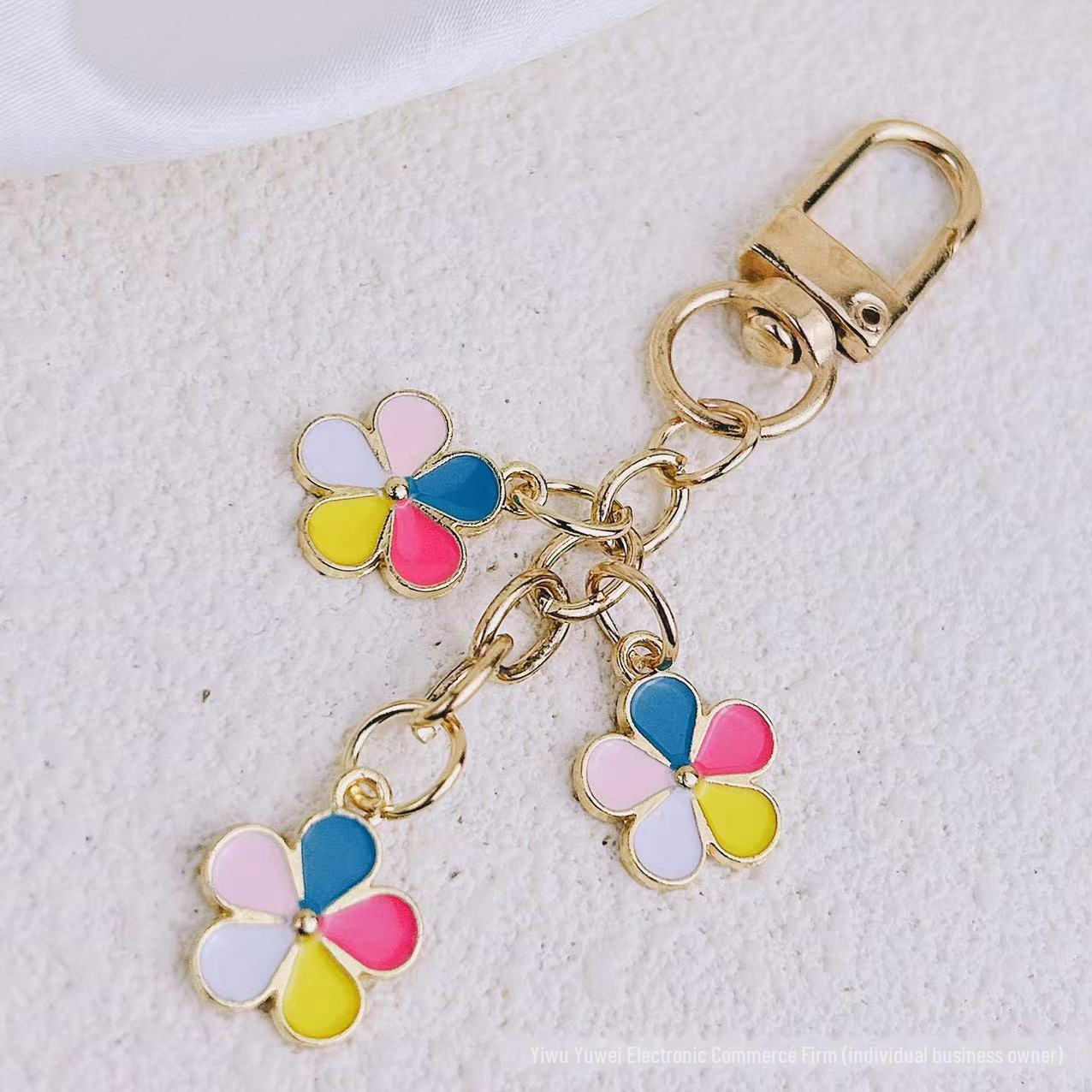 

Европейский и американский летний брелок с цветком цвета капли масла для мобильных телефонов, сумок и автомобилей. Each style individually packed