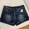 Pantaloncini in denim blu scuro a vita bassa da donna, vestibilità slim, a trapezio, booty shorts, abbigliamento casual da strada, hot pants