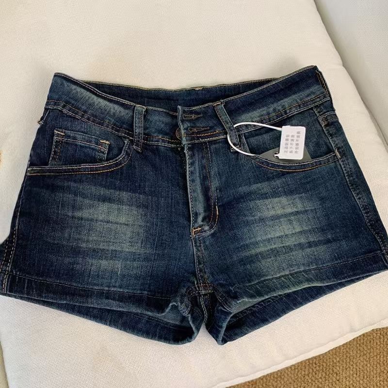Pantaloncini in denim blu scuro a vita bassa da donna, vestibilità slim, a trapezio, booty shorts, abbigliamento casual da strada, hot pants
