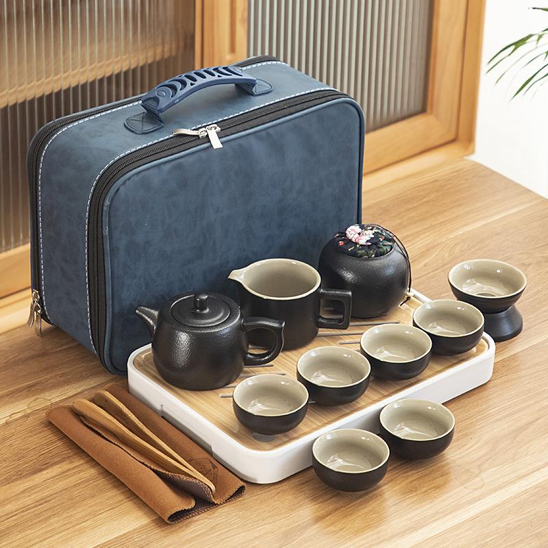 Black pottery travel kung fu tea set portable business gift set creative ceramic cooling pot set