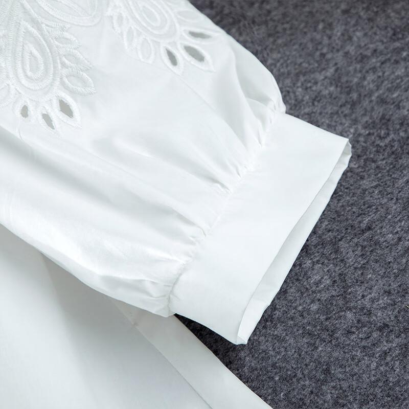 Damskjorta med broderi och utskärningar för pendling