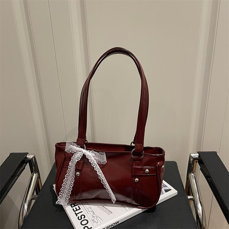 French niche bag women's new bow pillow bag shoulder messenger bag portable baguette bag