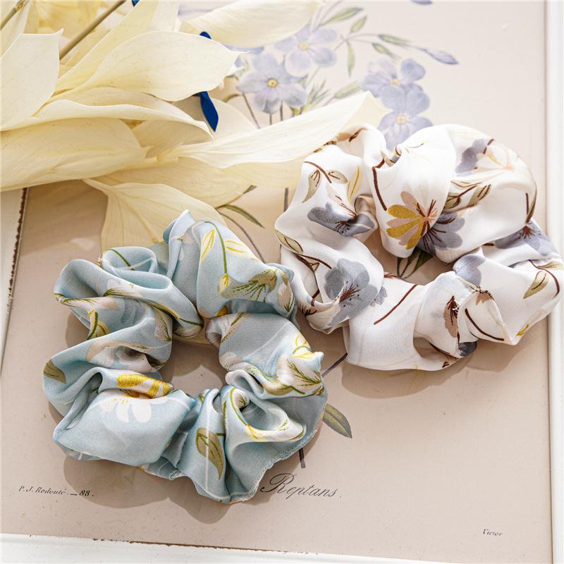 French-style smooth satin scrunchie with floral pattern, versatile elastic hair tie for women, popular on Instagram