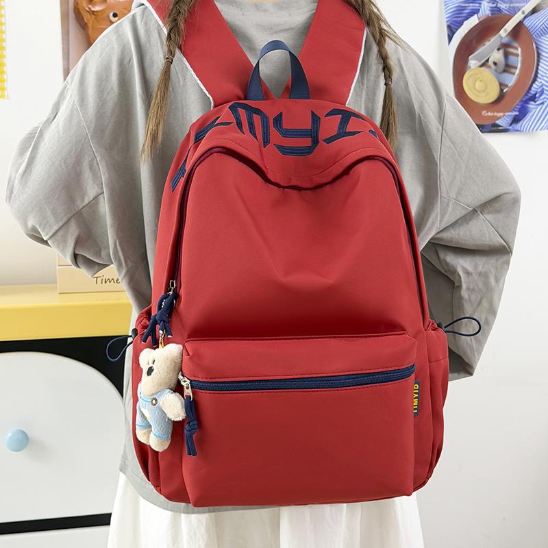 Schoolbag Japanese simple and versatile large-capacity solid color campus schoolbag 1011 summer new light commuter student backpack
