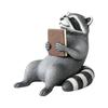 Book-Holding Plastic Raccoons Figurine Shelf Sitter with Sitting Form and Gray-and-Black Detail, a Reading-Themed Accent for Desks, Bookshelves