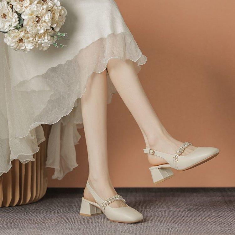 

French bag head sandals women s 2025 new summer wear medium heel thick heel with skirt Roman pearl high heels 40