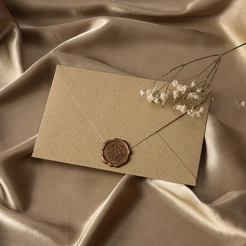 Retro Chinese Linen Pattern Letter Set with Kraft Paper, Sealing Wax, and Envelopes.