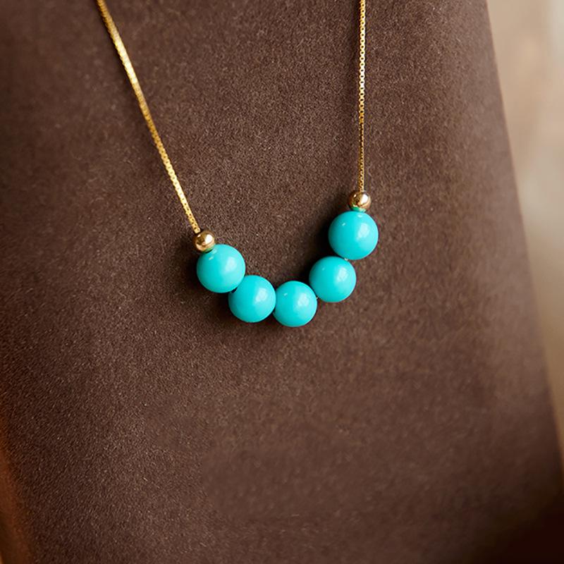 

Бірюзове намисто з круглих намистин зі срібним підвісом, ланцюжок для светра в китайському стилі.