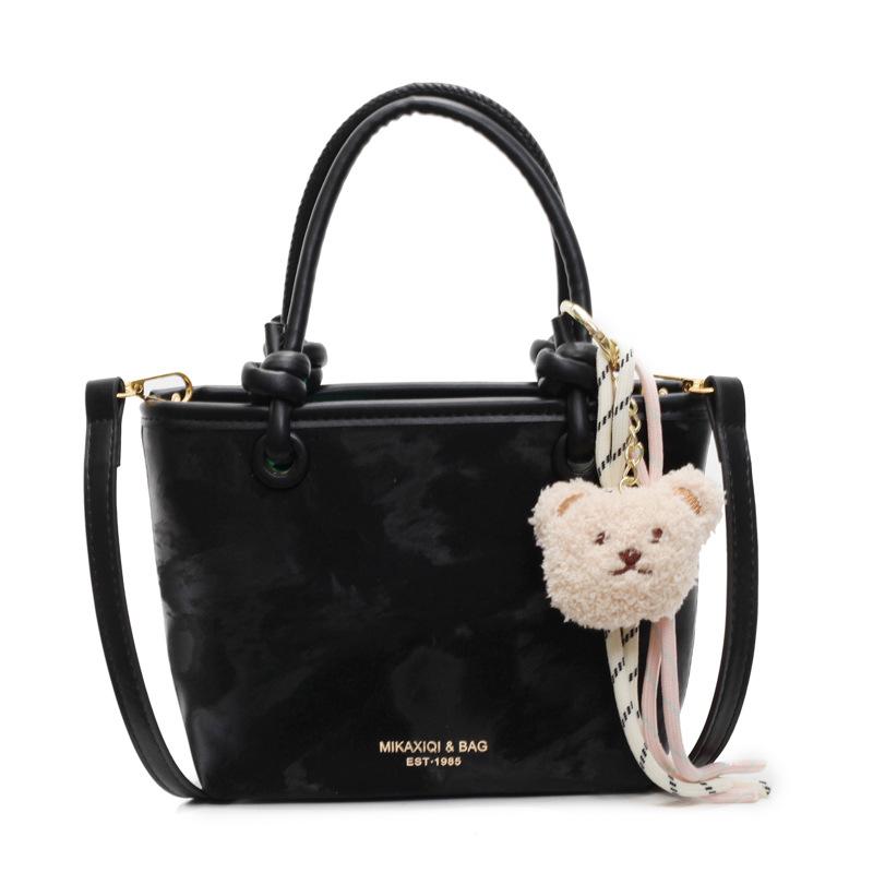 Korean version ins trendy personality contrasting colors casual hand carrying bucket bag fashion high sense versatile temperament messenger bag woman