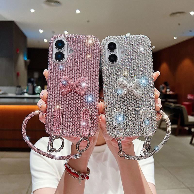 Premium flash diamond bow lanyard mobile phone case is suitable for Apple 17Promax women's Iphone16 protective case.