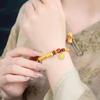 Lotus Seed Pod Half-Bangle Bracelet In Gold with Sunflower Accents and DIY Braided Rope Design