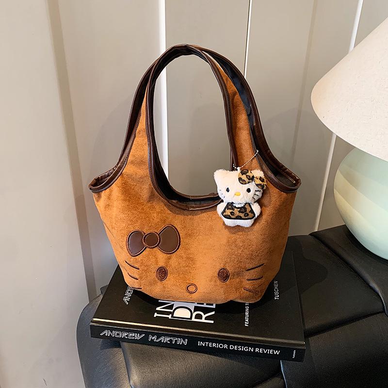 

High-Value Cute Suede Cartoon Handbag: Girls Fashion Versatile Commuter Shoulder & Retro Crossbody Bag for Autumn-Winter.