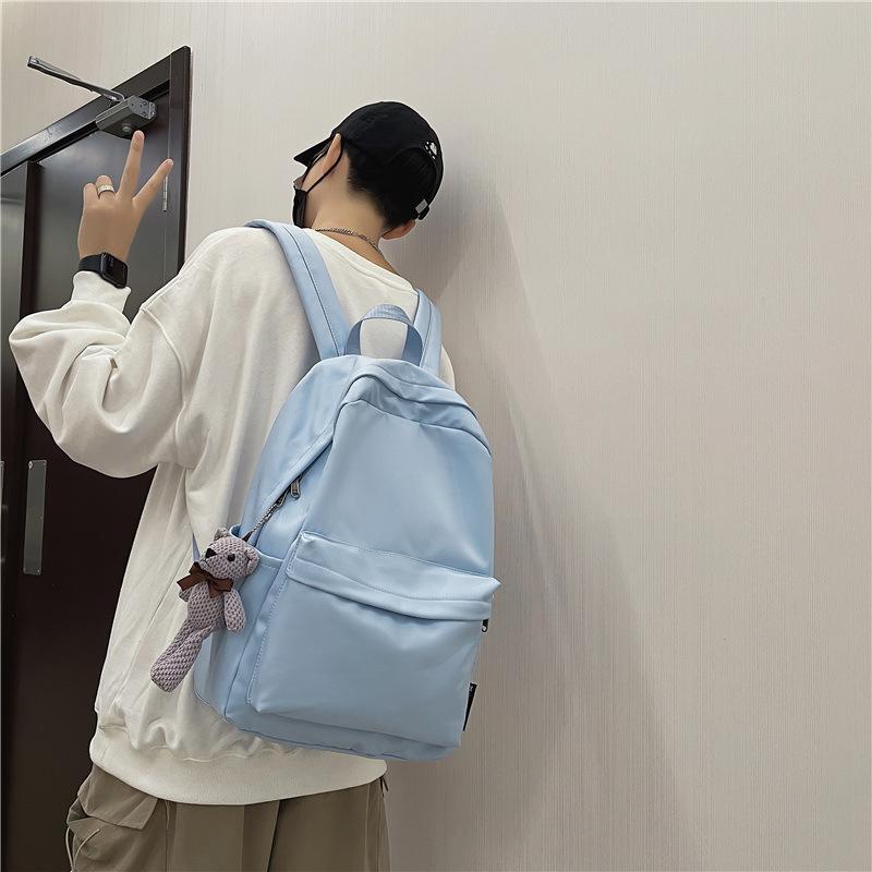 School bag female 2025 Korean version couple new large-capacity solid color versatile shoulder back trendy bag primary school students junior high sc