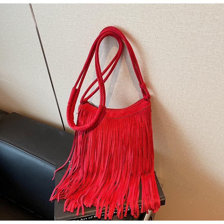 Oblique span tassel bag women's new fashion retro travel versatile bucket bag