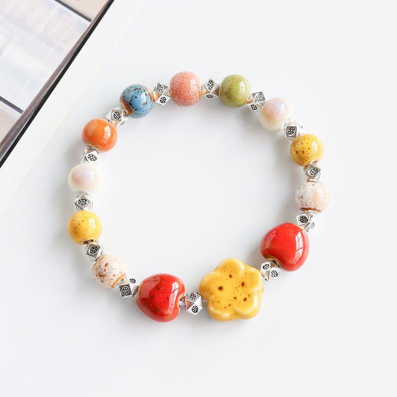 

Свежий керамический браслет Цзиндэчжэньский фарфор Розовые бусины Плетеный Студенческие украшения Ремешок для ношения Этнический стиль Браслет Доступная роскошь Фэнси Flower Glaze Yellow