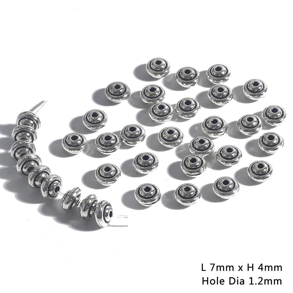 30–50 stk. avstandsperler i antikk metall med kjeglemønster til smykkelaging