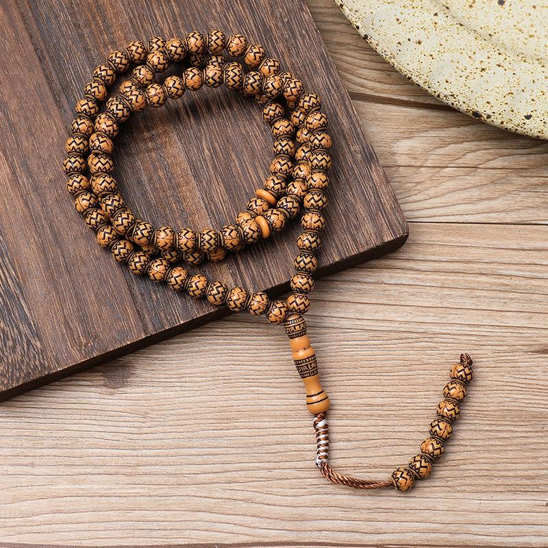 Ručně vyráběný 99-korálkový růženec Tasbih s imitací dřevěné kresby ze Saúdské Arábie