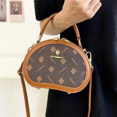 Chic Women’s Crossbody Bag Elegant Oval Design Detachable Strap Fashion and Functionality Premium Leather Ideal