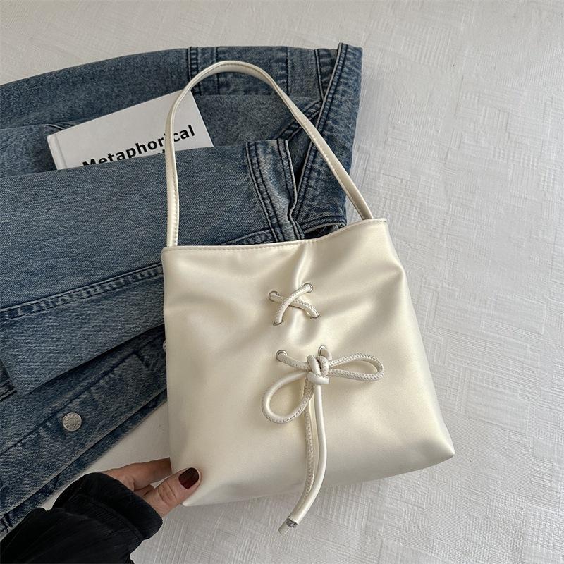 

Niche design portable bucket bag women s 2025 summer new fashion simple sweet bow underarm shoulder