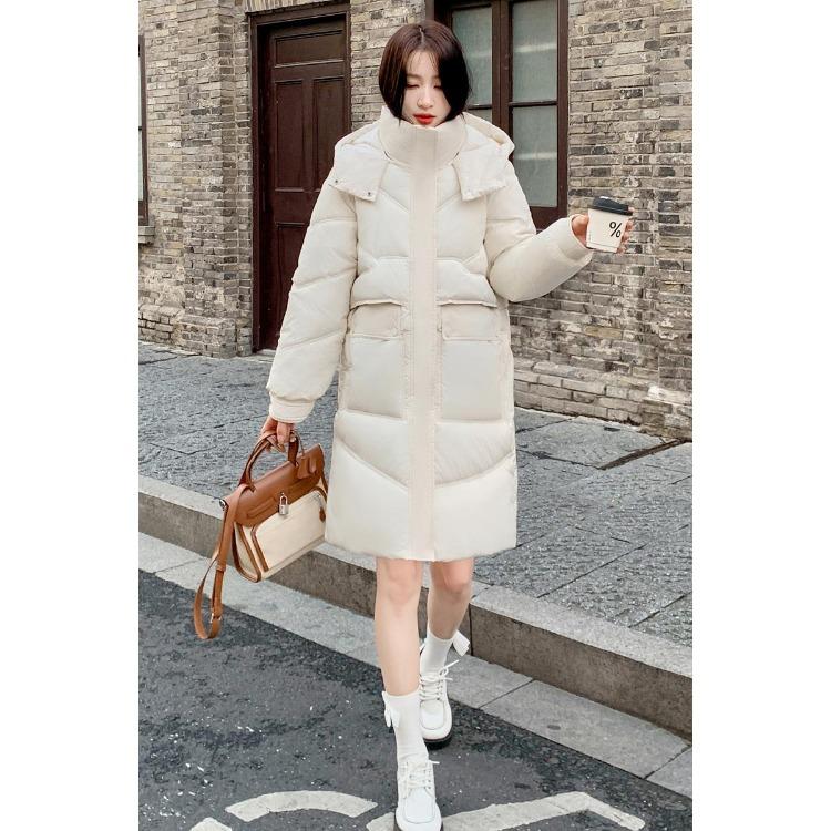 Μείνετε ζεστή και κομψή τον χειμώνα με αυτό το γυναικείο παλτό με κουκούλα μεσαίου μήκους σε κορεατικό στυλ.