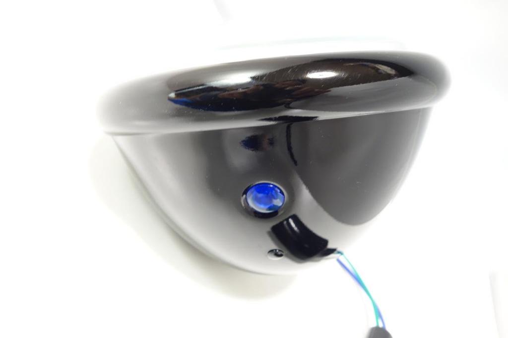 5.5-inch Bates-style headlight, black body, H4 bulb, custom headlight with clear lens.