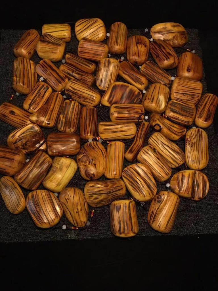 Tiger Stripe Cypress Wood Carved Pendant