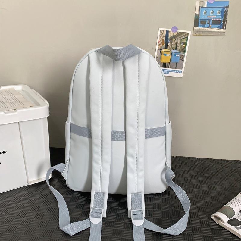 School bag 2025 new solid color simple backpack college student Korean version school bag versatile simple casual fashion backpack
