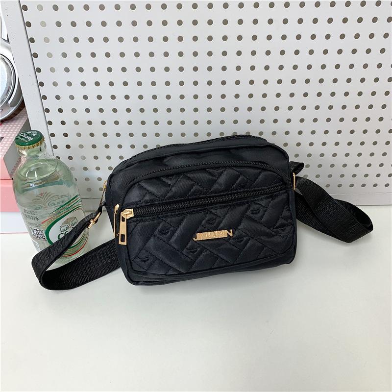 

The new Chinese lady s mother bag large-capacity travel storage mobile phone bag multi-layer Oxford cloth women s bag чорний