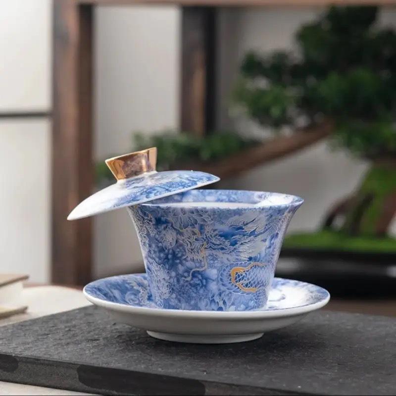 Rotating Sancai Gaiwan: Enamel Color Mutton Fat Jade Porcelain Tea Bowl with Lid for Kung Fu Tea Brewing.
