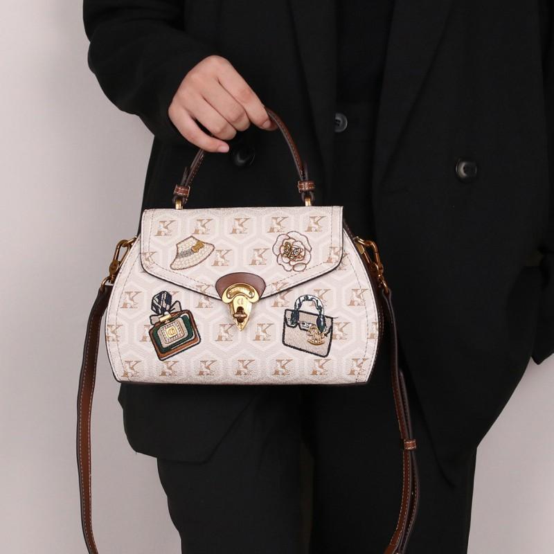 High-end Light Luxury Badge Rivet Saddle Bag Retro Contrasting Color Single Shoulder Cross-slung Handbag