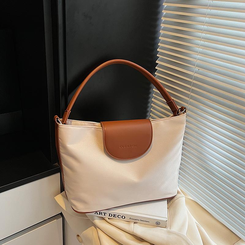 

Niche high-end underarm bag women s bag 2025 new simple contrasting color handbag versatile messenger bucket bag бежевий