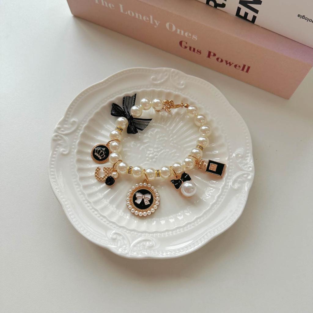 Pearl Necklace with Black Butterfly Knot