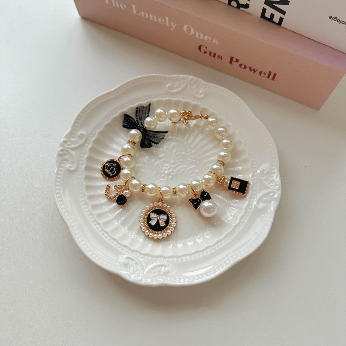 

Pearl Necklace with Black Butterfly Knot L чёрный