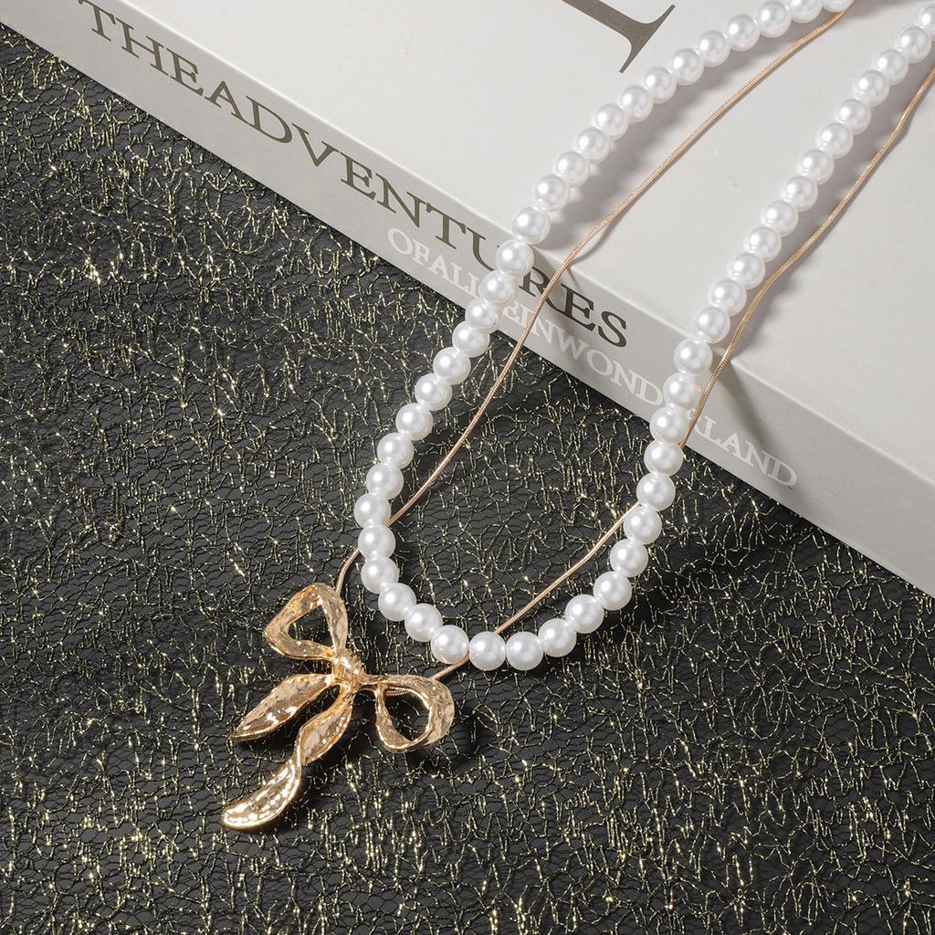 Light luxury imitation pearl fashion one more wear personalized metal bow pendant women's necklace