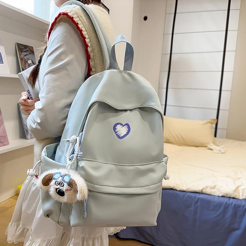 School bags, female college students, simple solid colors, love, junior high student, niche and versatile girls, high school student backpacks, trends