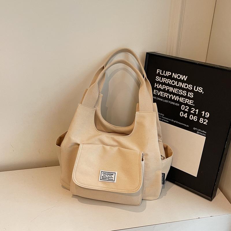 

New Japanese Minimalist Canvas Simple Tote Bag Women Fashiable and Versatile Small Shoulder Bag Casual Design Commuting Bag