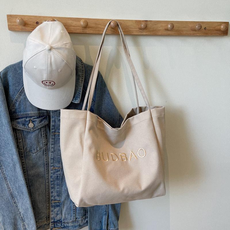 

2025 new spring casual simple foreign style tote bag women lazy large capacity personalized trend simple shoulder bag хакі