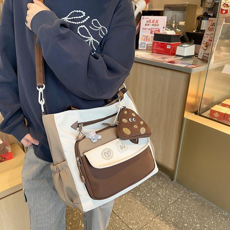Korean version ins exquisite and cute contrasting colors large-capacity student tutoring bag literary and small fresh women's shoulder messenger bag