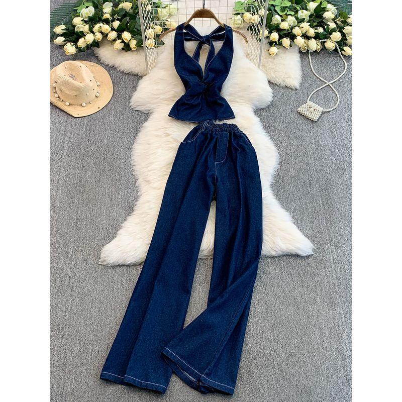 European and American Sexy V-neck Twist Waist Hugging Hanging Neck Denim Vest Top + High Waist Slimming Flared Wide Leg Trousers Set