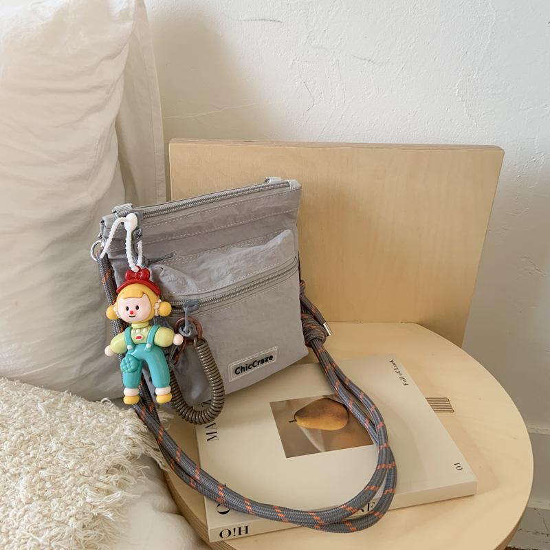 Shoulder bag women's solid color couple outdoor summer new lightweight messenger bag men's and girls outdoor sports small satchel