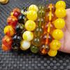 Translucent Flower and Chicken Fat Yellow Artificial Amber Round Bead Bracelets
