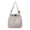 Rear zipper drawstring casual bag women's new fashion large cloth bag large capacity tote bag class commuter messenger bag