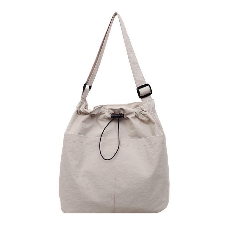 Rear zipper drawstring casual bag women's new fashion large cloth bag large capacity tote bag class commuter messenger bag