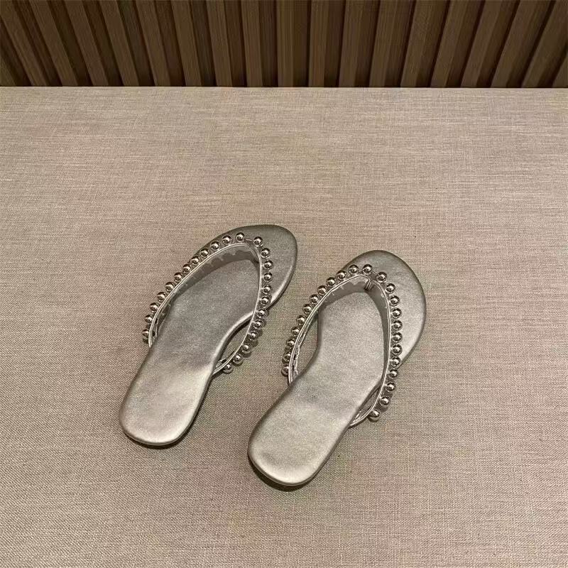 

Sheepskin version of beach flip-flops women s outer wear pearl high-end sense flat bottom non-slip fashion toe cool 41 серебряный