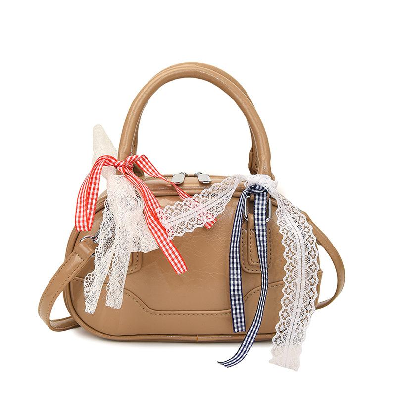 Frühling 2025 neu Ou Ruofeng Koreanische Version von einfacher tragbarer Boston-Tasche Nische lässig vielseitige Umhängetasche Tasche Damen