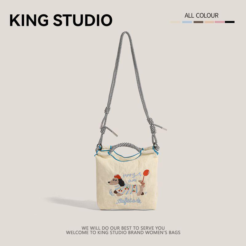 

Japan fashion Embroidered Cute Sausage Dog Bucket Bag Women 2025 New Mobile Phone Bag Versatile Commuter Shoulder Messenger Bag White