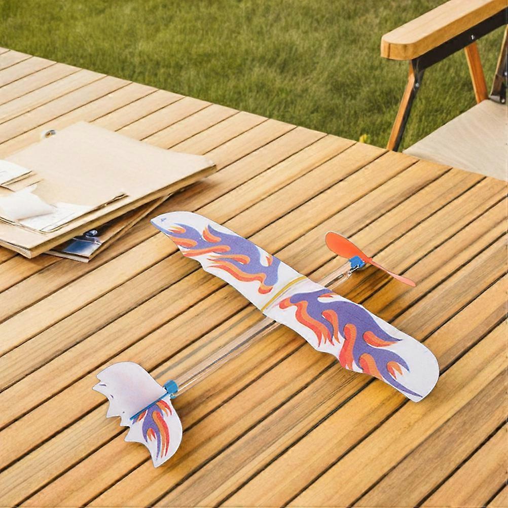 4pcs Flying Glider Plane: Rubberband Powered Airplane Kits Windup Copter Toys for Kids Party Favors Boys and Girls Outdoor Fun and DIY Activities